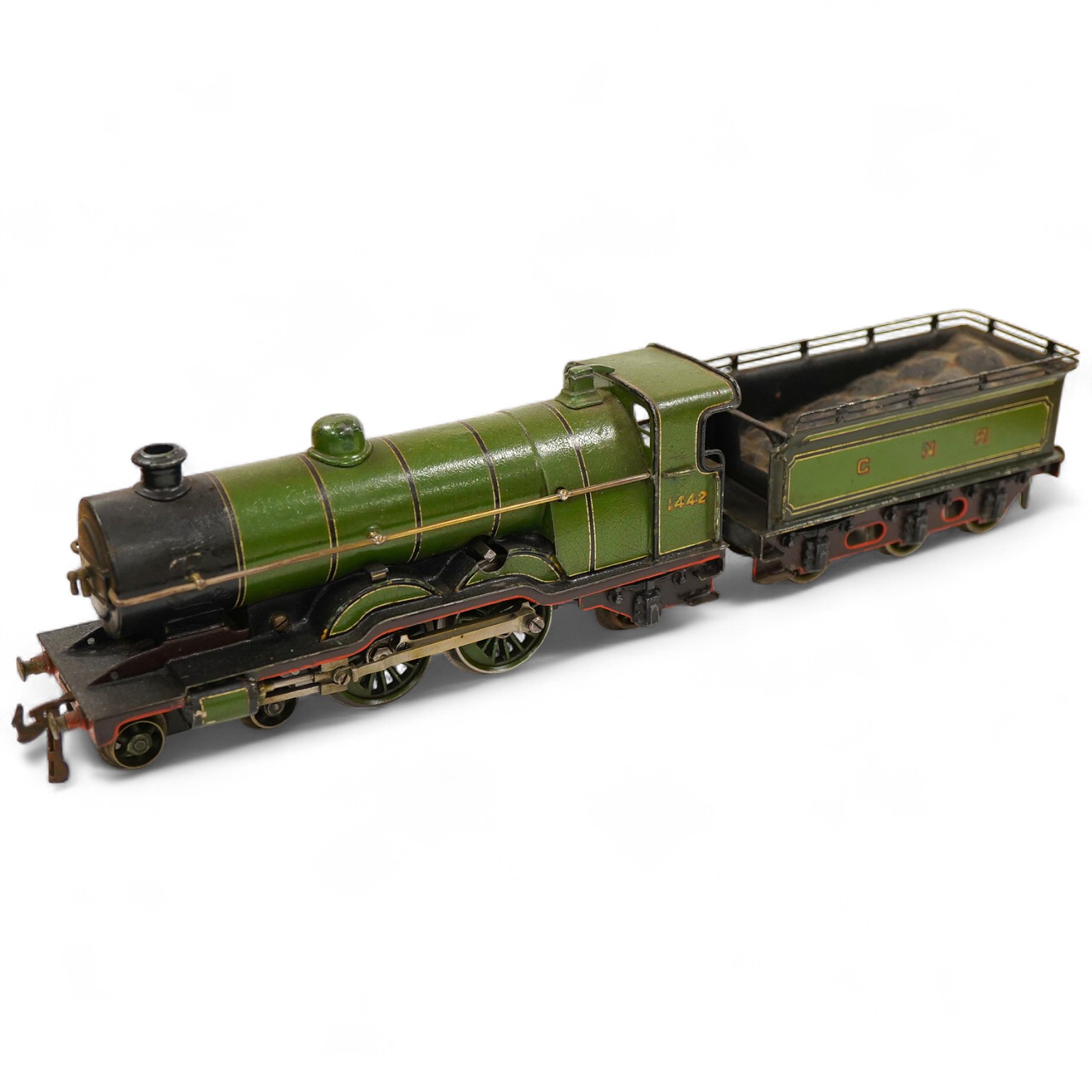 An 0 gauge Bing (or possibly Carette) for Bassett-Lowke tinplate clockwork GNR 4-4-2 tender locomotive, 1442, with original clockwork mechanism in yellow and black lined green livery